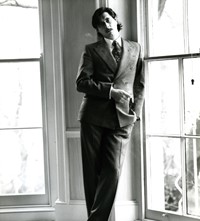 BF with moustache standing by window; 1976 [1]