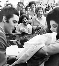Elvis_Presley_and_Priscilla_with_Lisa_Marie_Februa