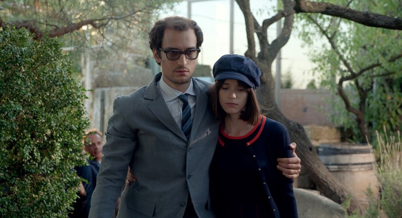 Louis Garrel as Jean-Luc Godard and Stacy Martin as Anne Wia